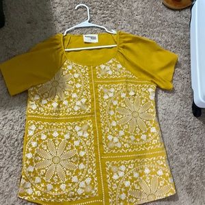 Yellow shirt with white embroidery